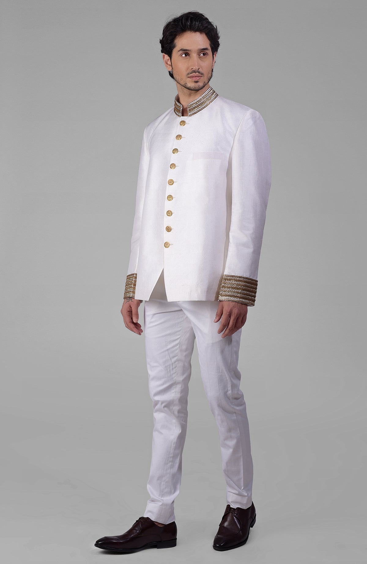 Ivory-gold Zardozi hand-embroidered silk Bandhgala jacket with golden buttons.