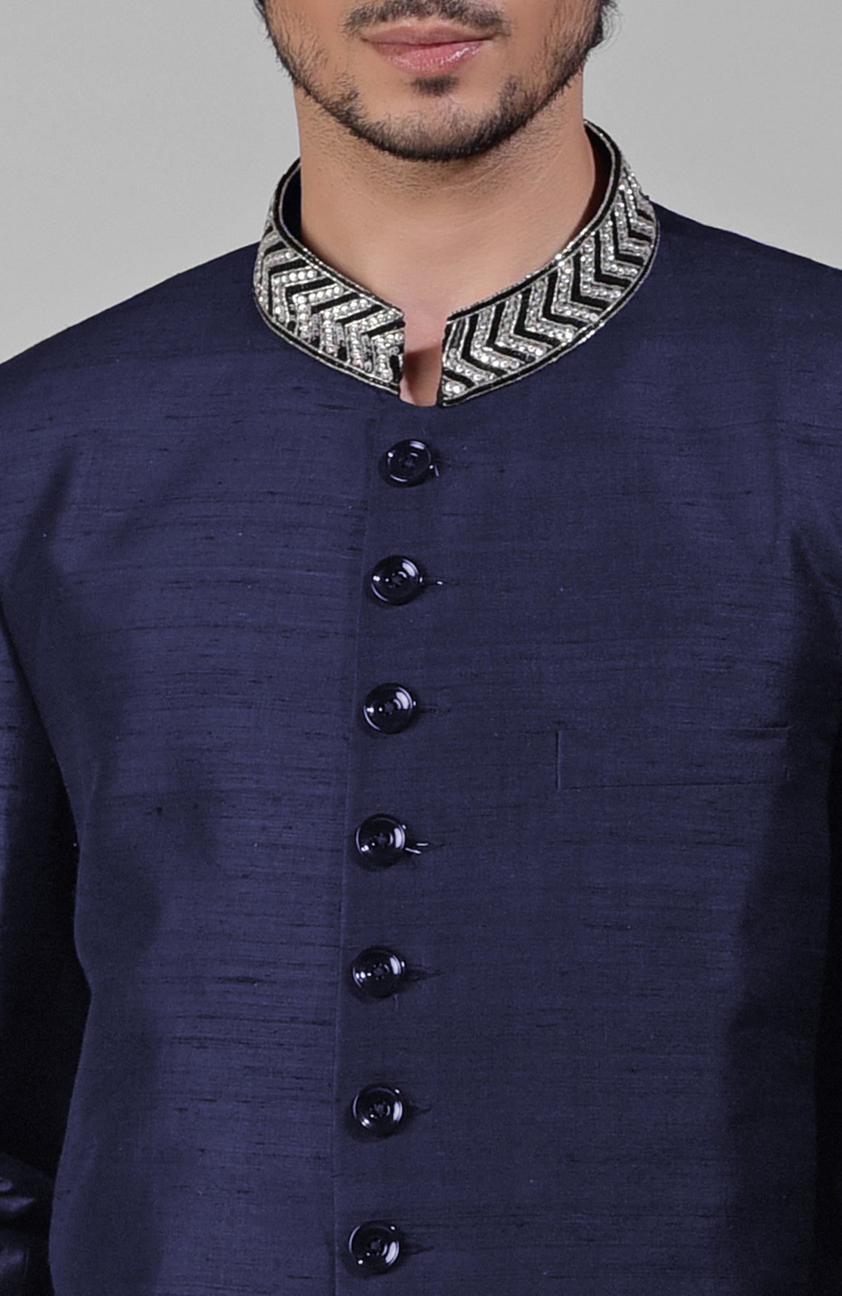 Navy blue silk bandhgala jacket with zardozi embroidery and matching tencil cotton pants set