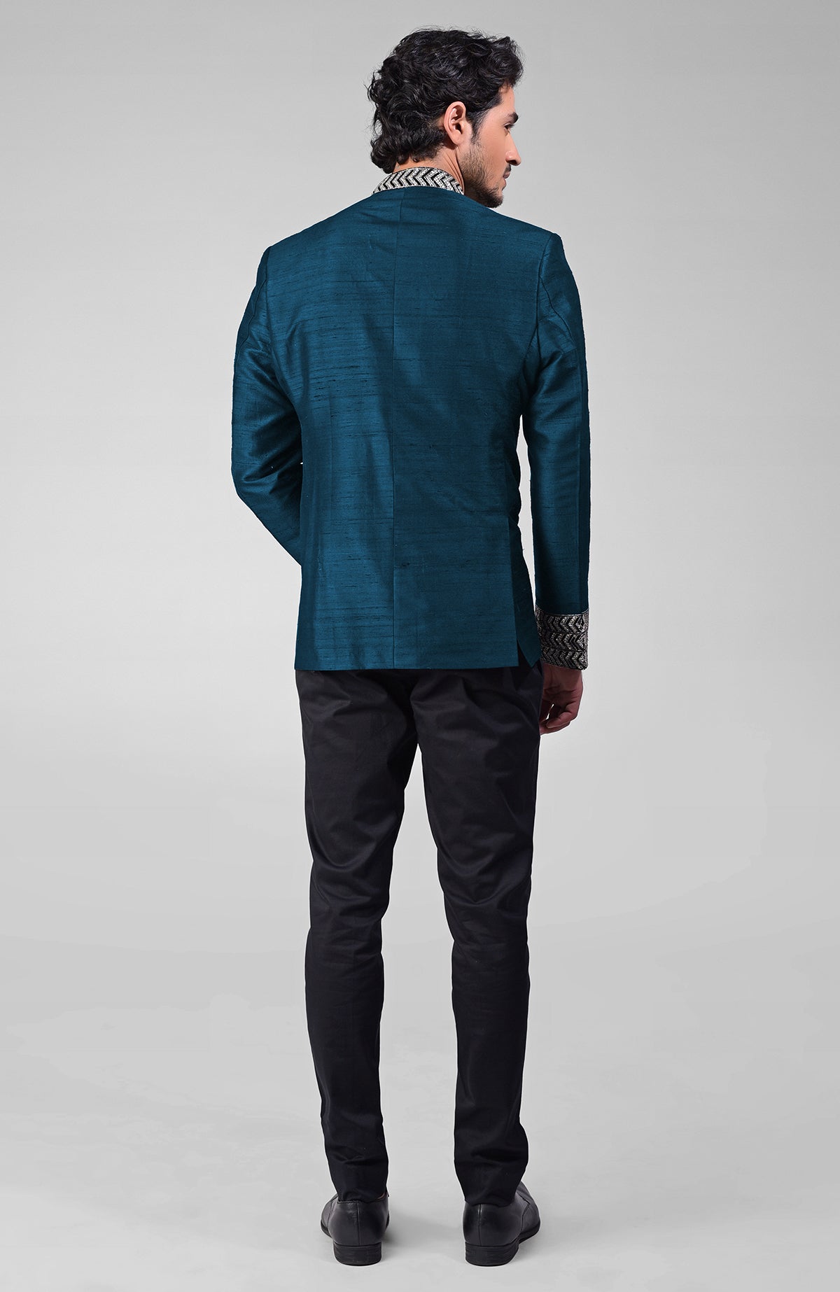 Teal silk bandhgala jacket with zardozi embroidery and matching tencil cotton pants set