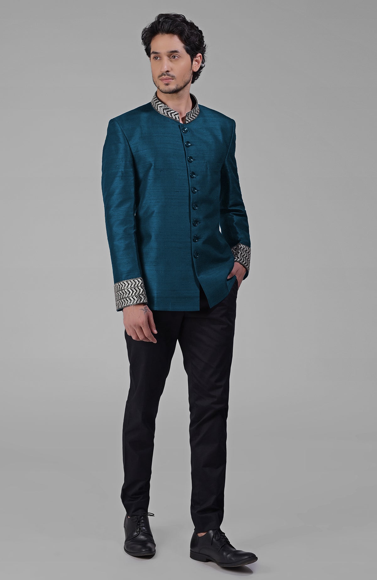 Teal silk bandhgala jacket with zardozi embroidery and matching tencil cotton pants set