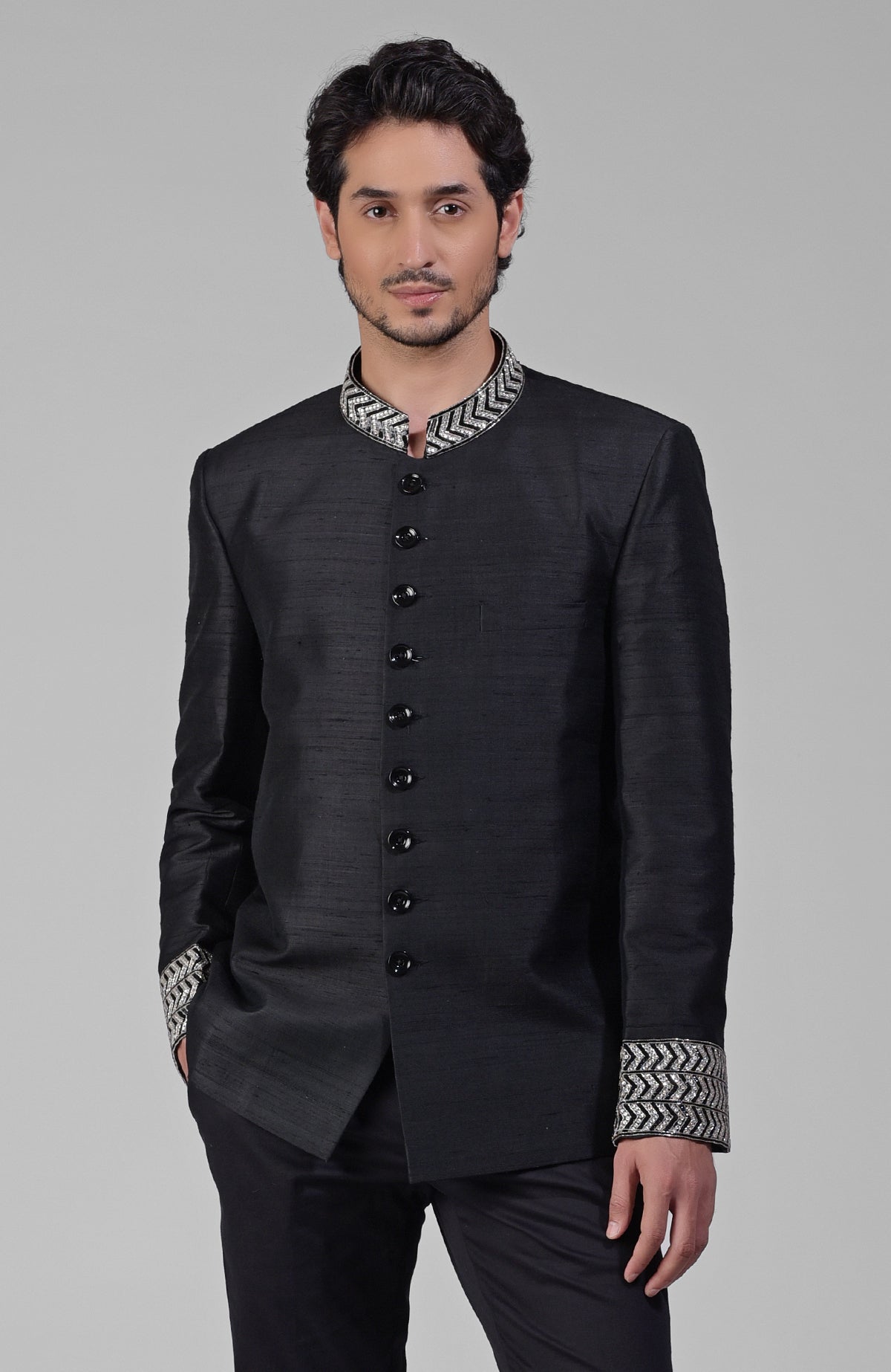Charcoal grey silk bandhgala jacket with zardozi embroidery and beadwork details.