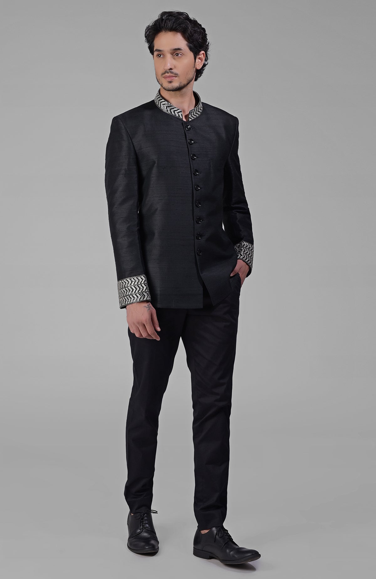 Black silk bandhgala jacket with zardozi embroidery and matching tencil cotton pants set