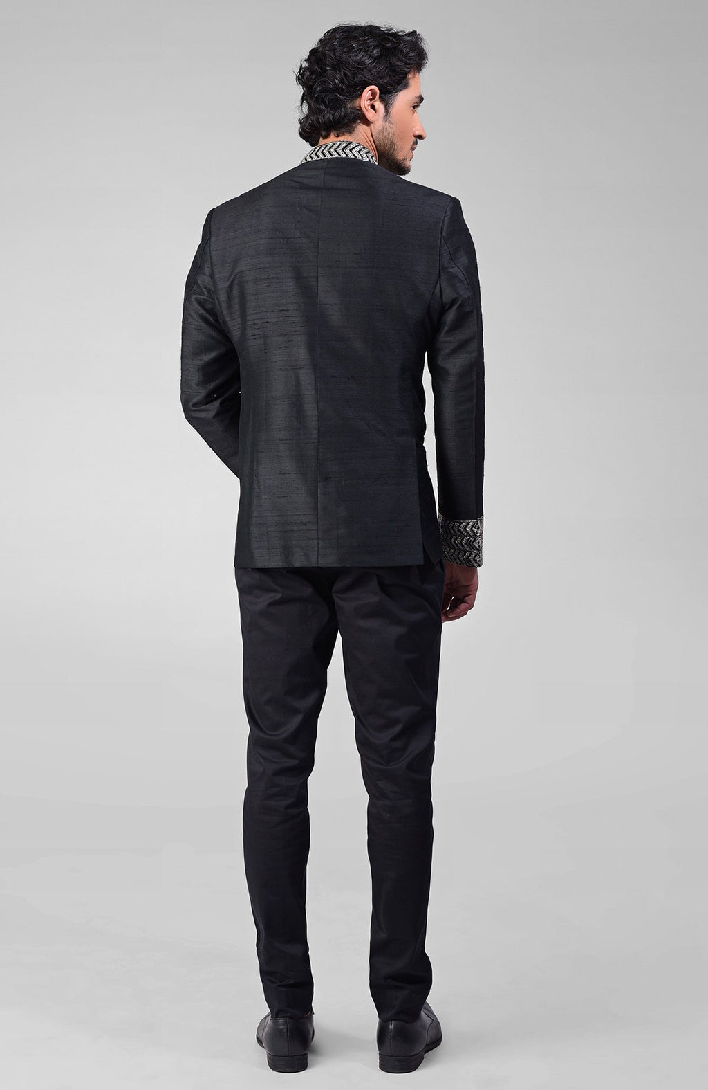 Black silk bandhgala jacket with zardozi embroidery and matching tencil cotton pants set