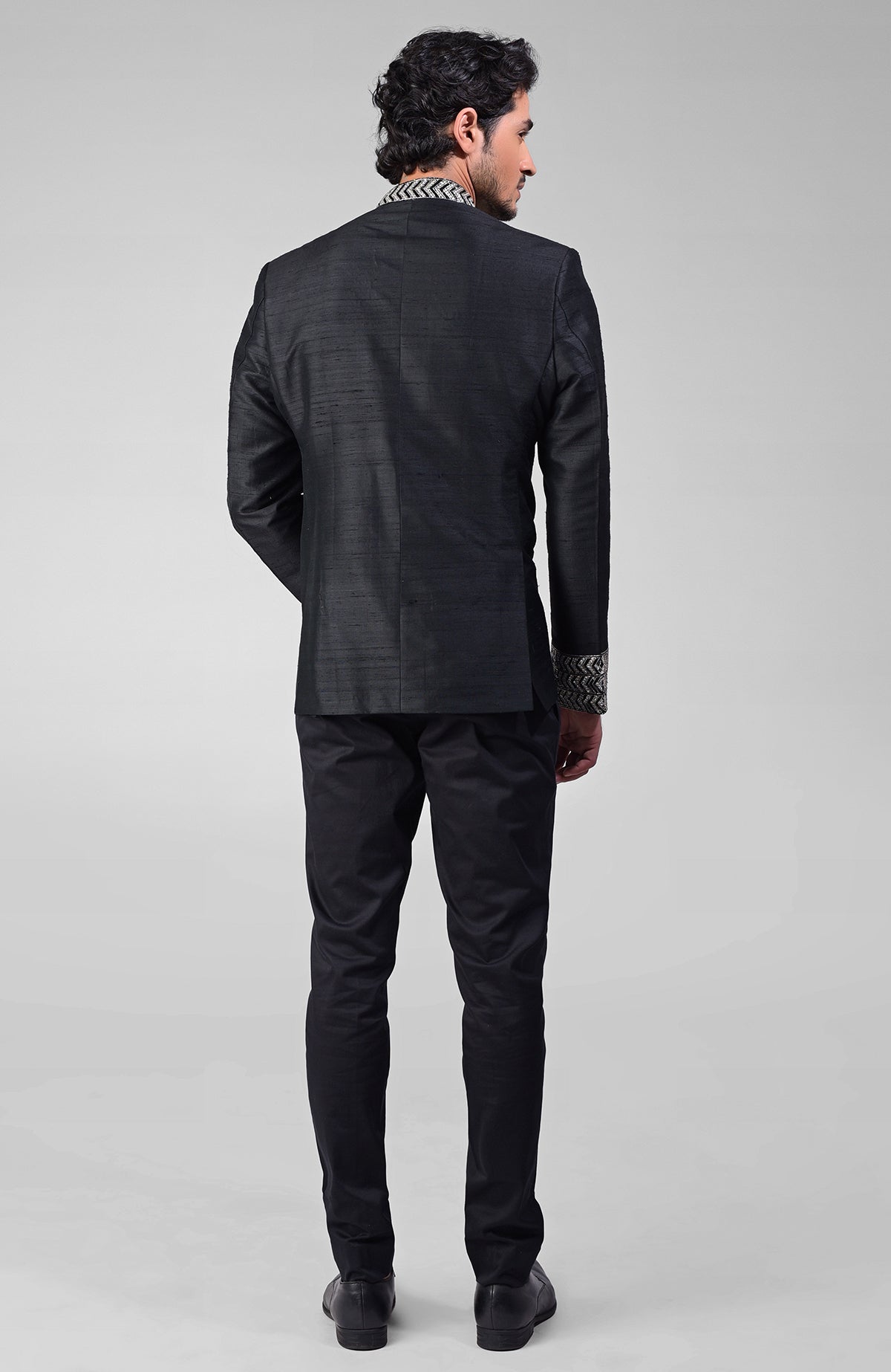 Black silk bandhgala jacket with zardozi embroidery and matching tencil cotton pants set