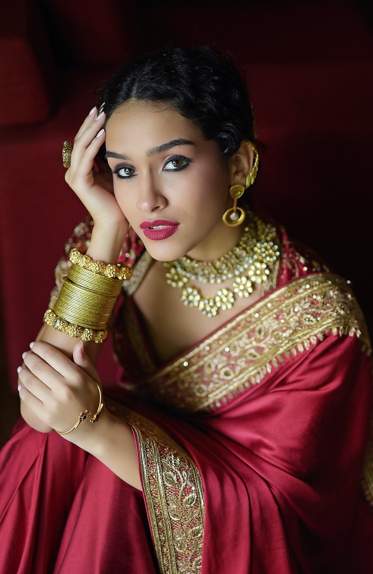 Blood red pure silk saree with gold hand-embroidered zardozi and beadwork borders and blouse