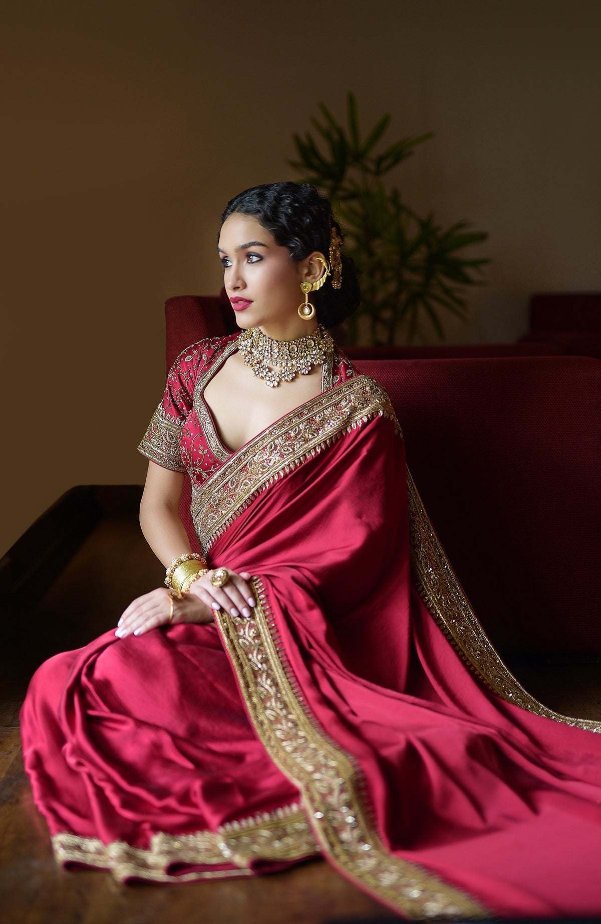 Blood red pure silk saree with gold hand-embroidered zardozi and bead work and matching blouse