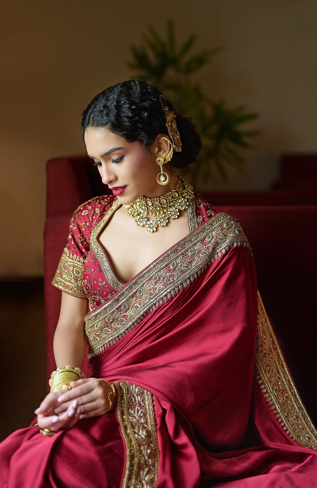 Blood red pure silk saree with gold zardozi hand embroidery and beadwork border.