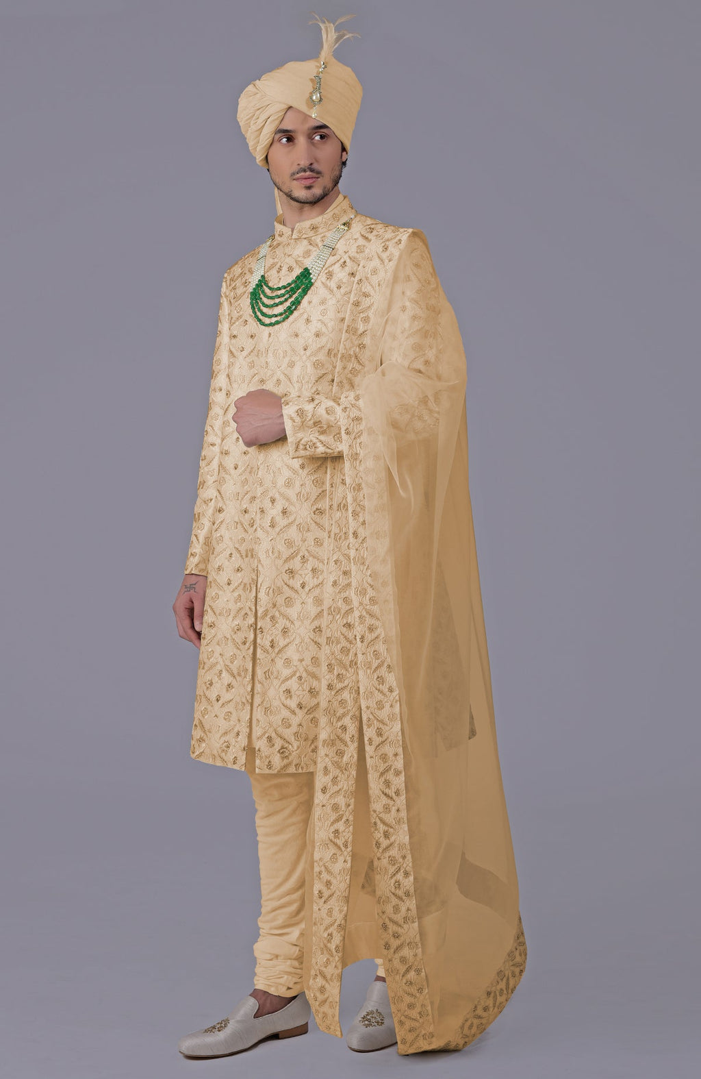 Golden sherwani set with floral embroidery, silk organza dupatta, and bead embellishments.