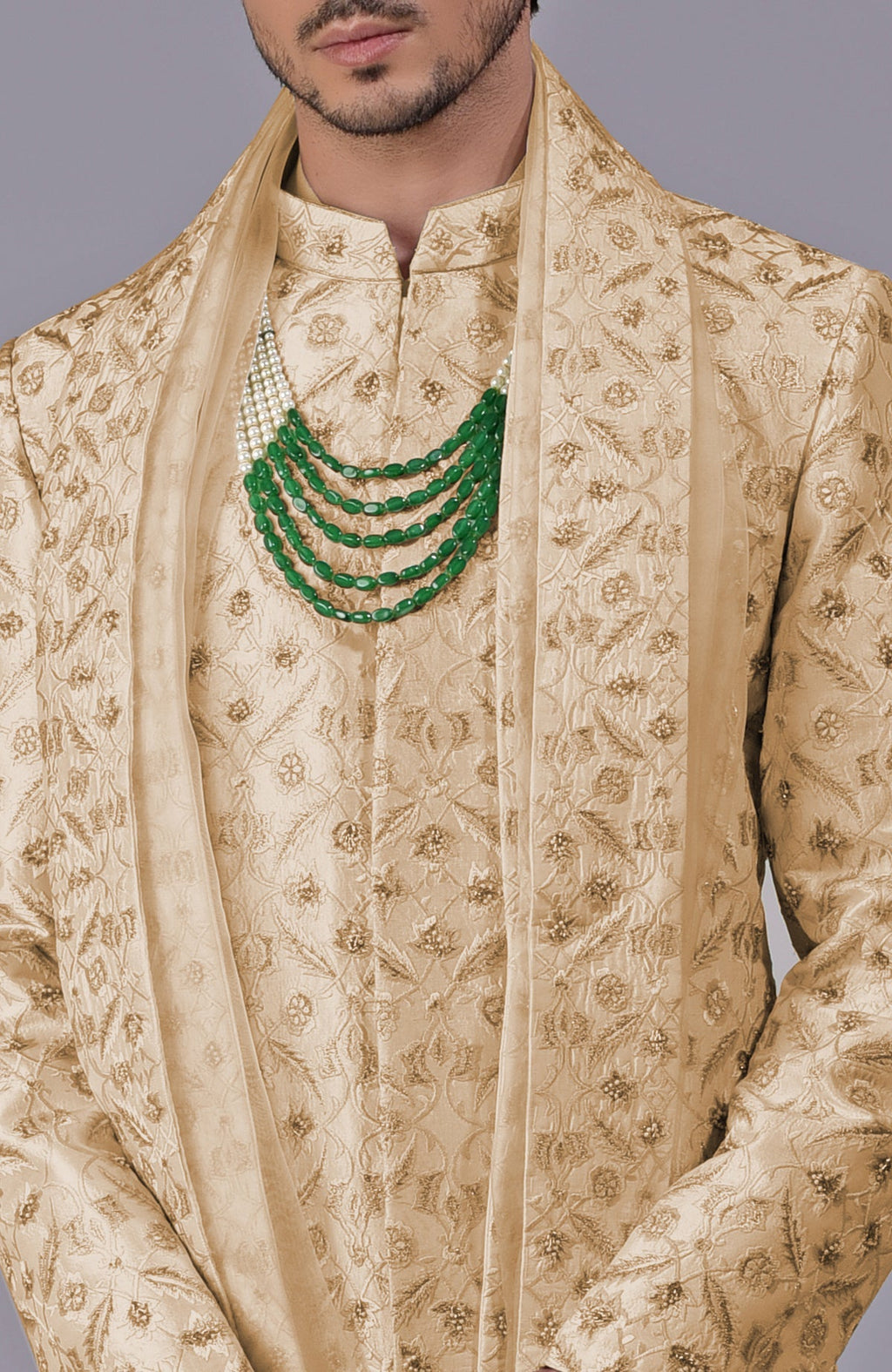 Golden sherwani with floral embroidery and silk organza dupatta in a 5-piece set.