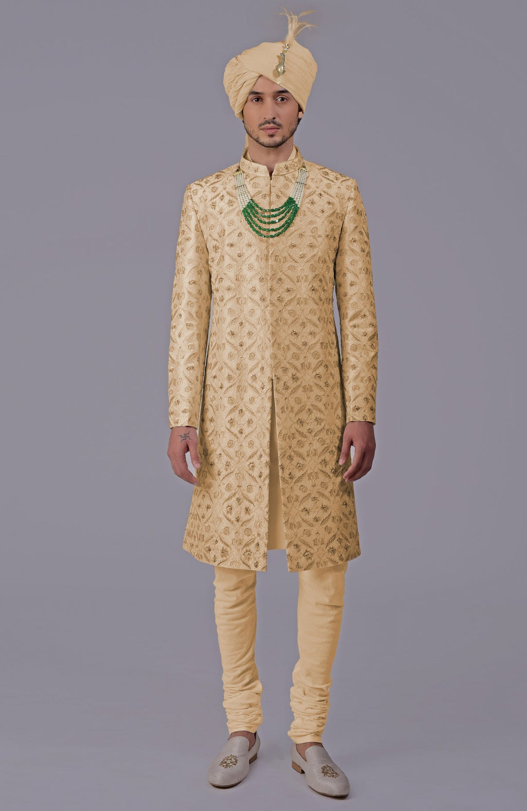 Golden sherwani set with floral embroidery, silk organza dupatta, and bead embellishments.