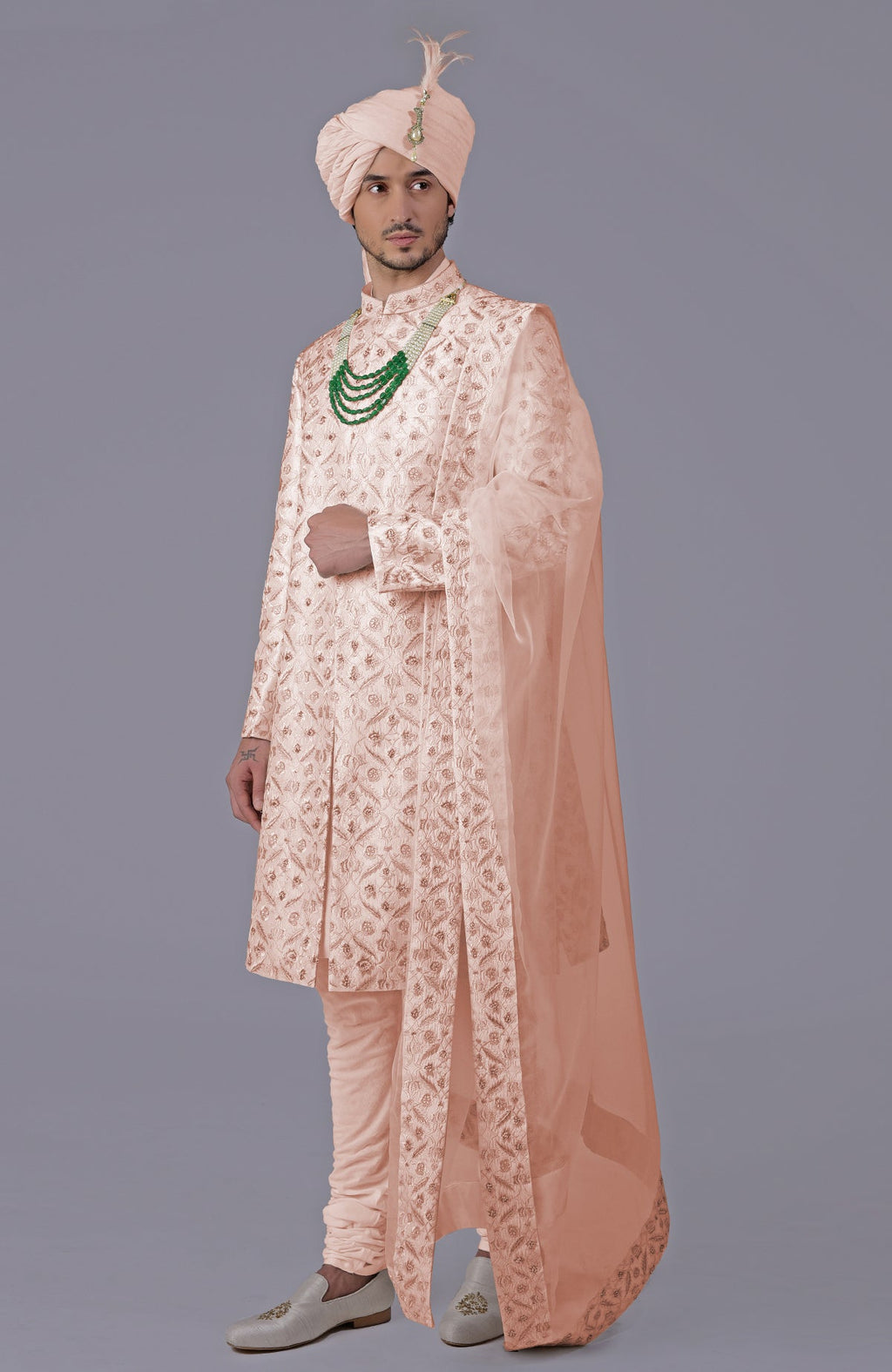 Golden sherwani set with floral embroidery, silk organza dupatta, and bead embellishments.