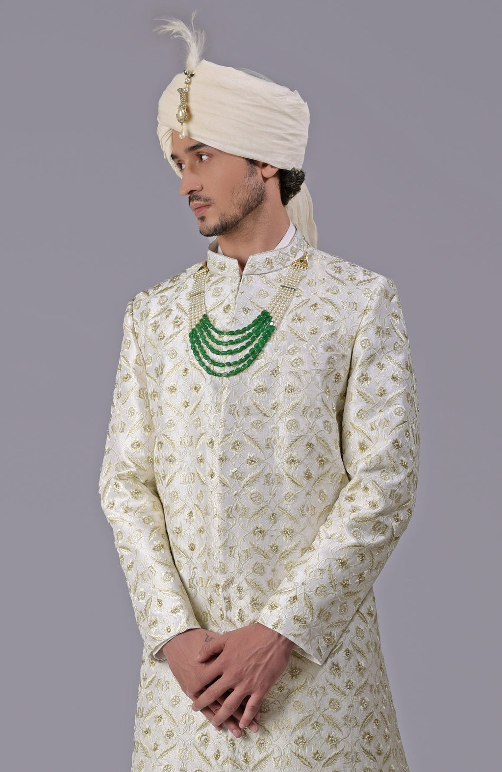 Ivory and gold sherwani with floral embroidery and silk organza dupatta in a 5-piece set.