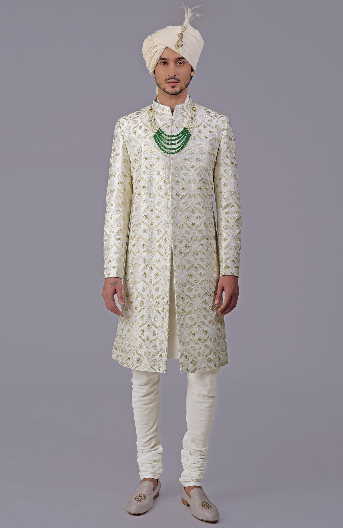 Ivory and gold sherwani with floral embroidery and silk organza dupatta set.