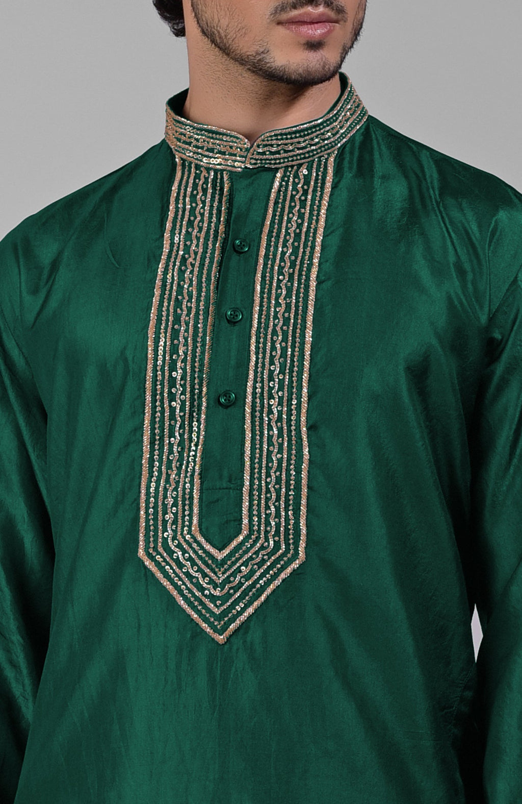 Dark emerald pure silk kurta set with hand embroidered zardozi, beadwork, and sequins.