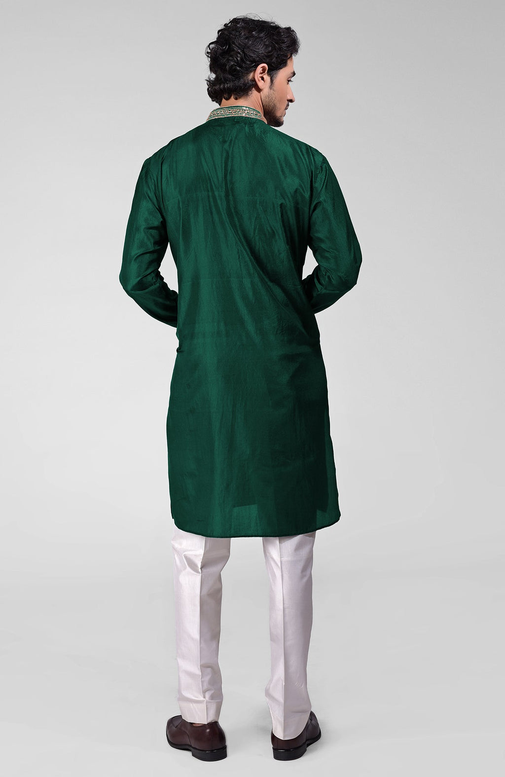 Dark emerald pure silk kurta set with hand embroidered zardozi, beadwork, and sequins.