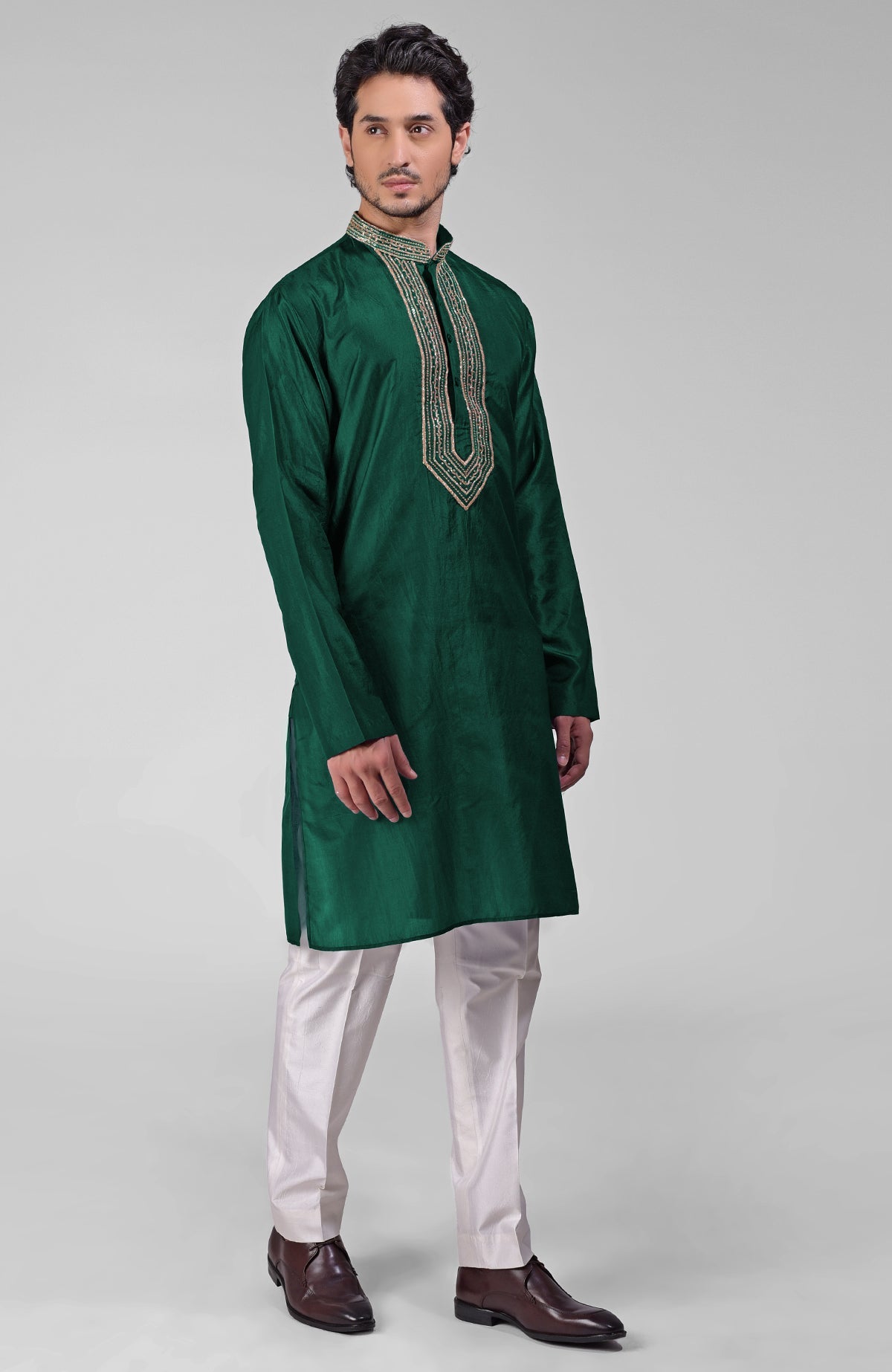 Dark emerald pure silk kurta set with hand embroidered zardozi, beadwork, and sequins.