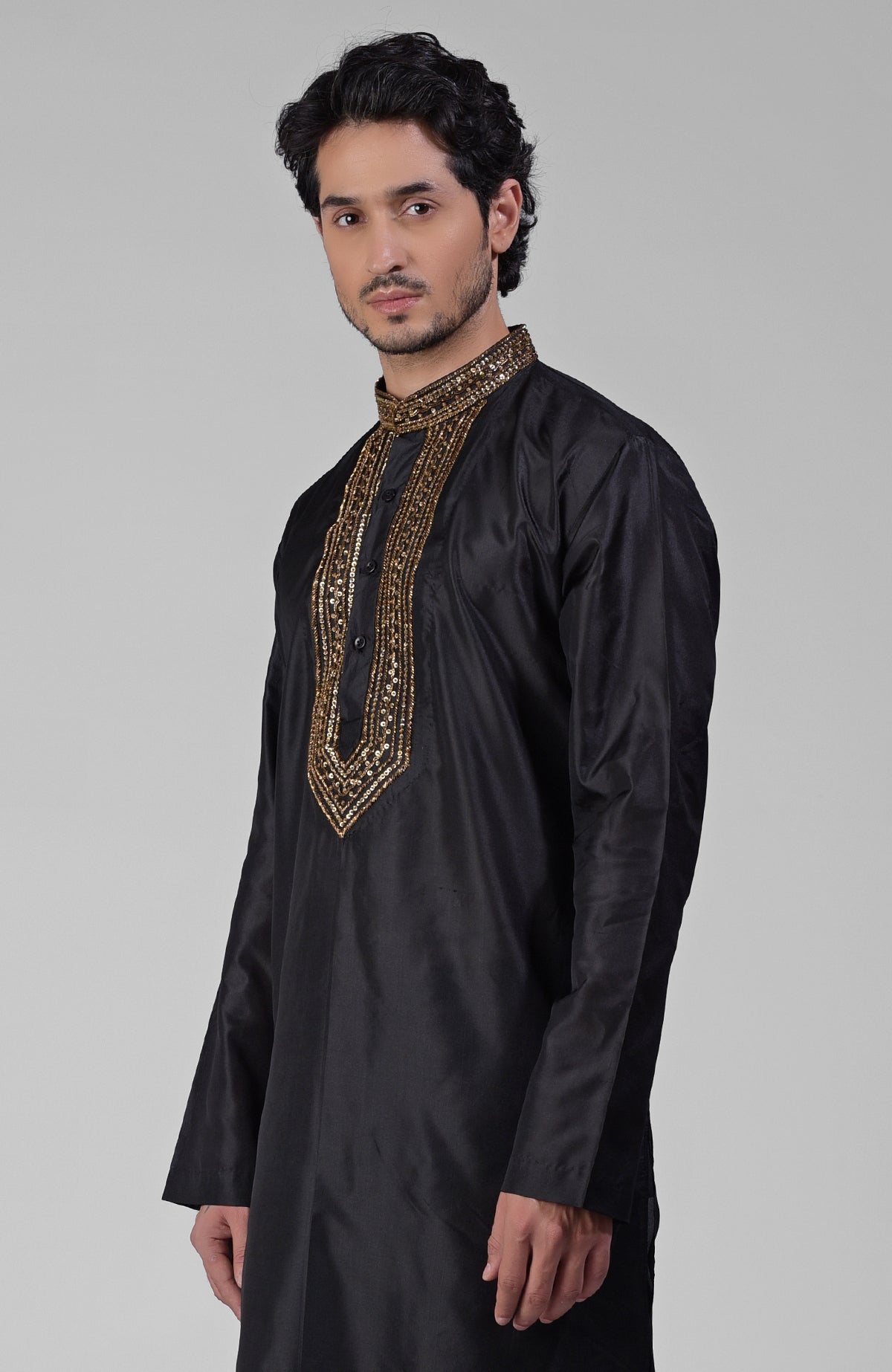 Black silk kurta set with zardozi embroidery, beadwork, sequins, and matching pants.