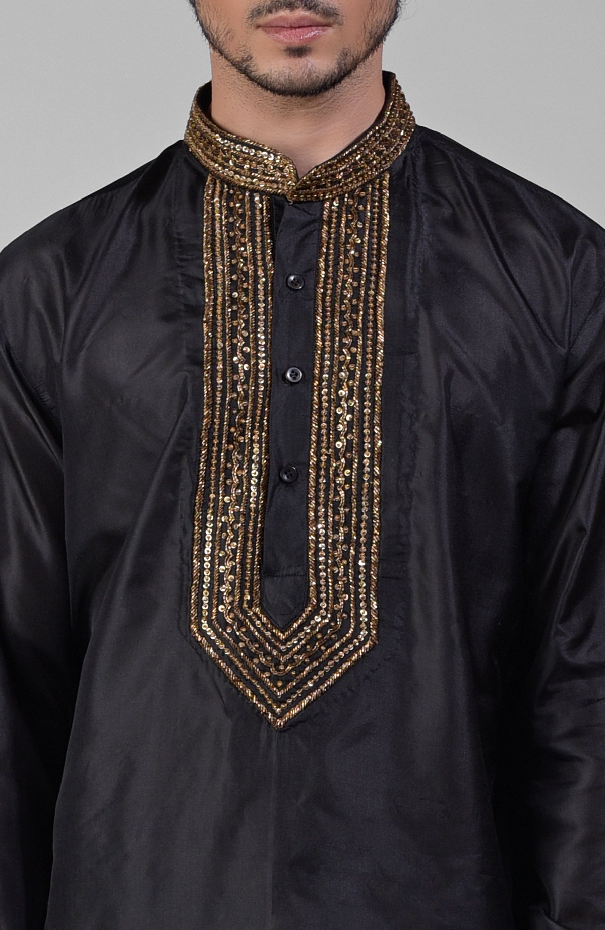 Black silk kurta set with zardozi embroidery, beadwork, sequins, and matching pants.