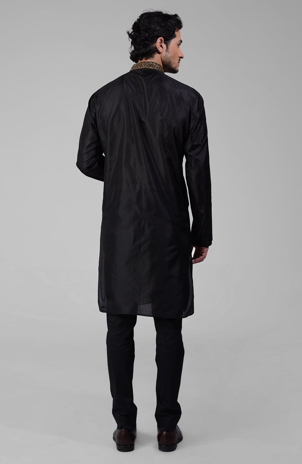 Black silk kurta set with zardozi embroidery, beadwork, sequins, and matching pants.
