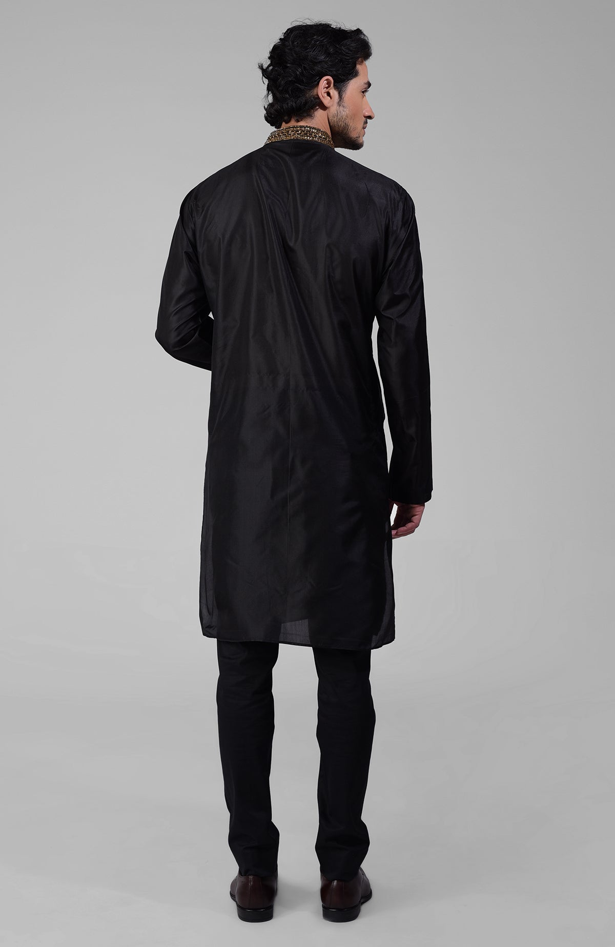 Black silk kurta set with zardozi embroidery, beadwork, sequins, and matching pants.