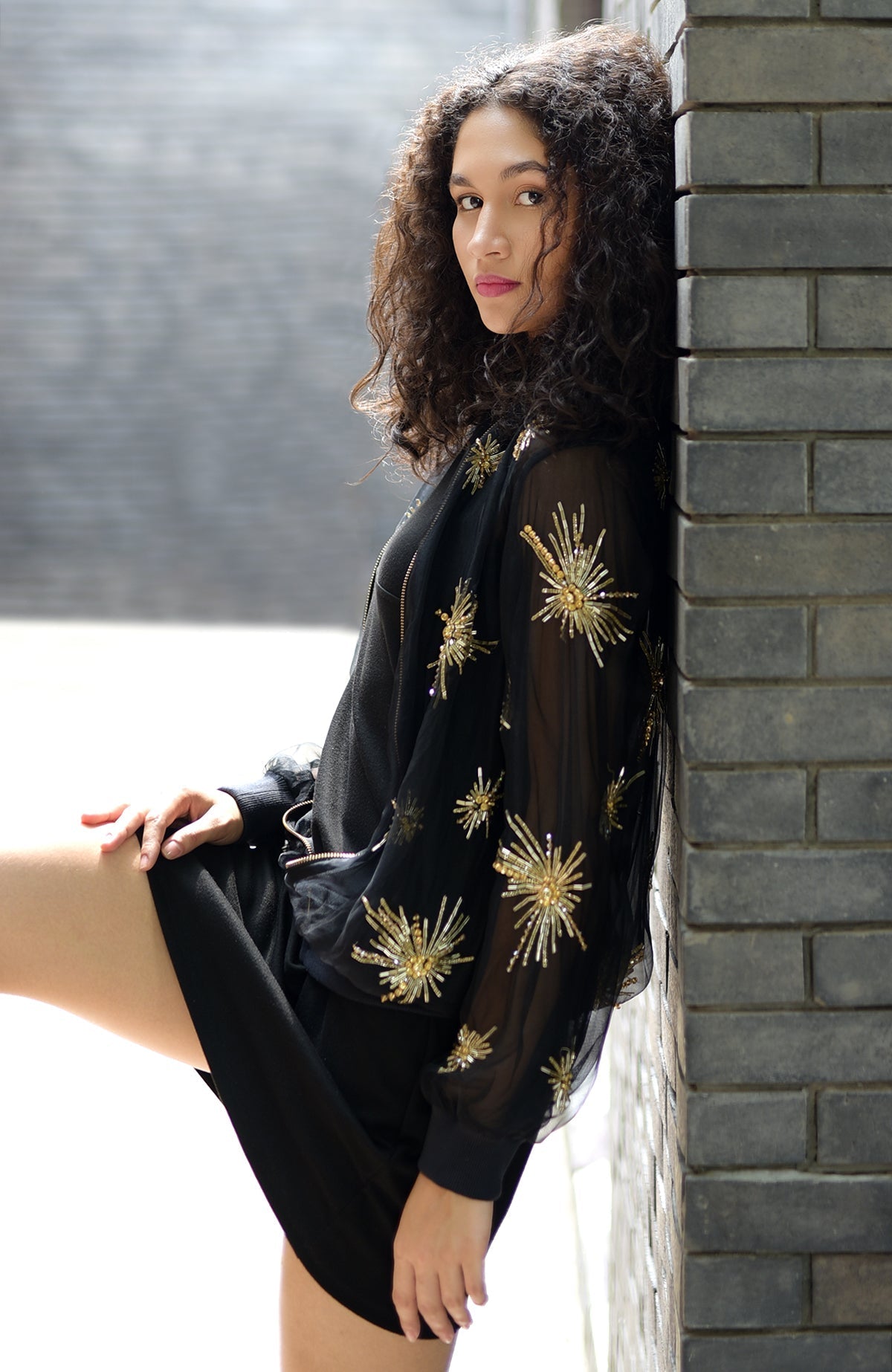 Black silk organza jacket with hand-embroidered starburst beads and sequins on front and sleeves