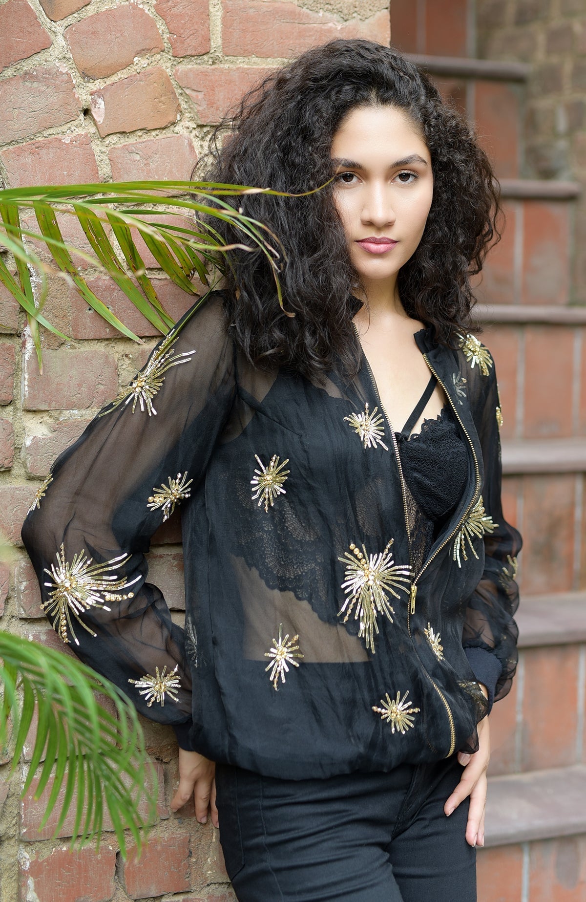 Black silk organza jacket with hand-embroidered starburst beads and sequins on front and sleeves