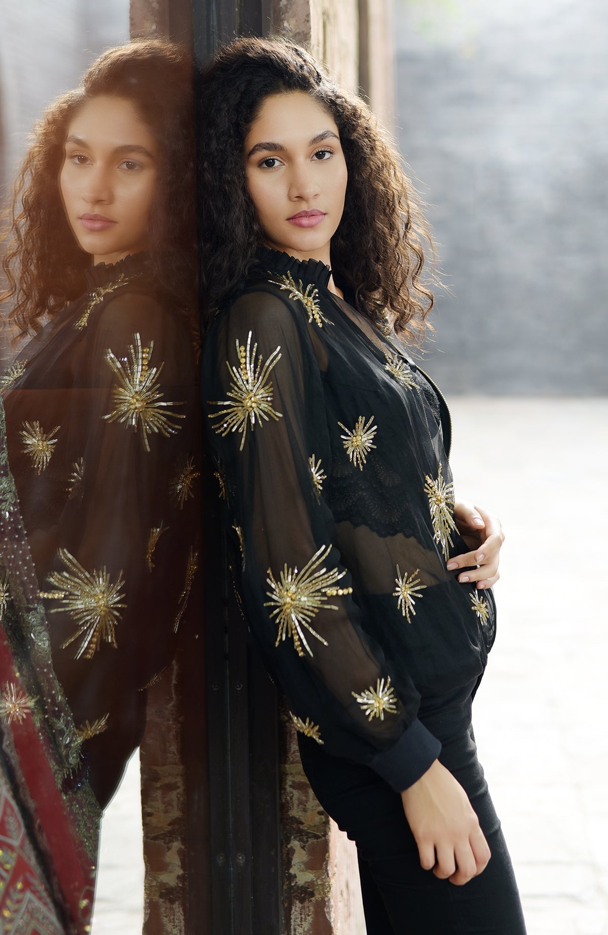 Black silk organza jacket with hand-embroidered starburst beads and sequins on tulle lining