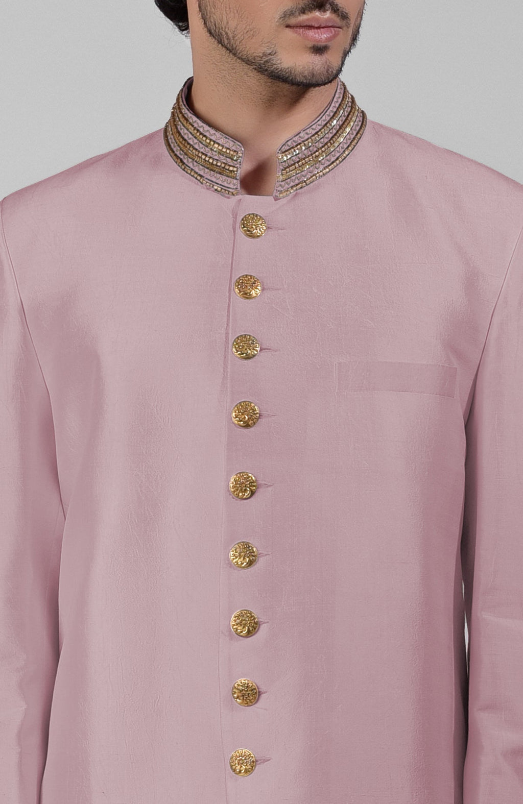 Burnished lilac silk bandhgala jacket with gold zardozi embroidery and golden button closure.