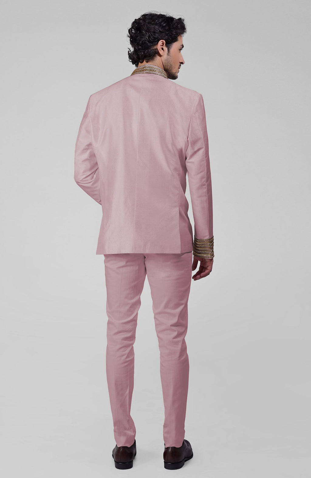 Burnished lilac silk bandhgala jacket with gold zardozi embroidery and golden buttons paired with white pants
