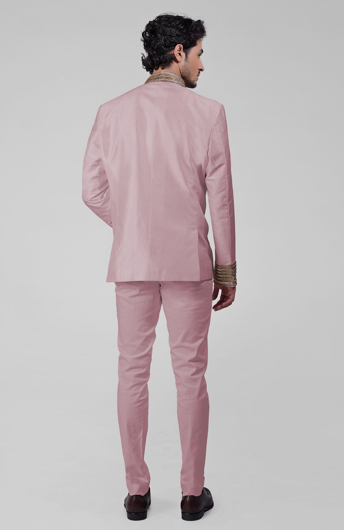 Burnished lilac silk bandhgala jacket with gold zardozi embroidery and golden buttons paired with white pants