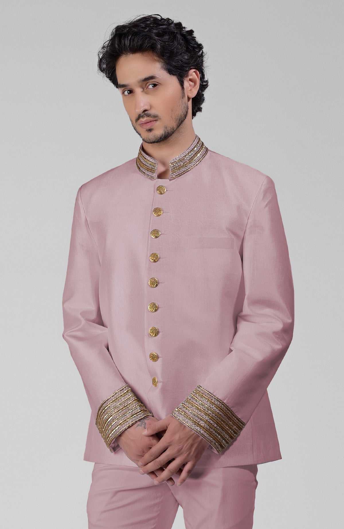 Burnished lilac silk bandhgala jacket with gold zardozi embroidery and golden buttons paired with white pants