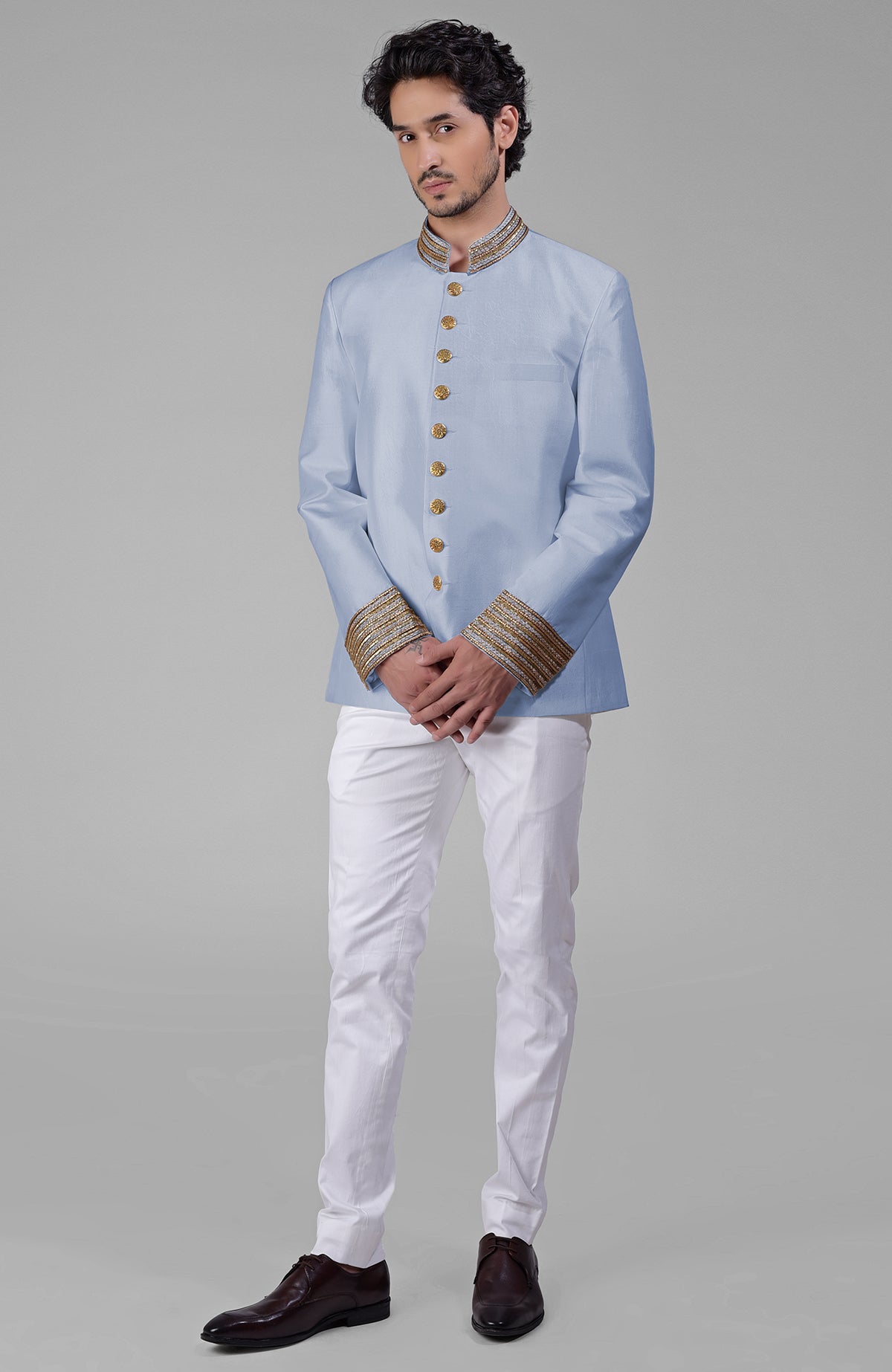 Ivory-gold silk bandhgala jacket with zardozi embroidery and golden buttons paired with white pants