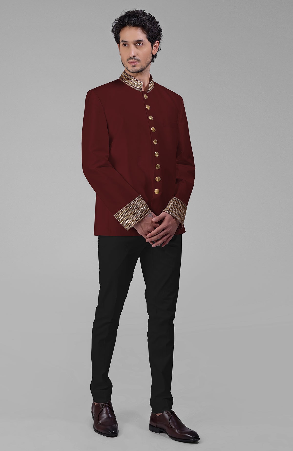 Teal silk bandhgala jacket with zardozi embroidery and matching tencil cotton pants.