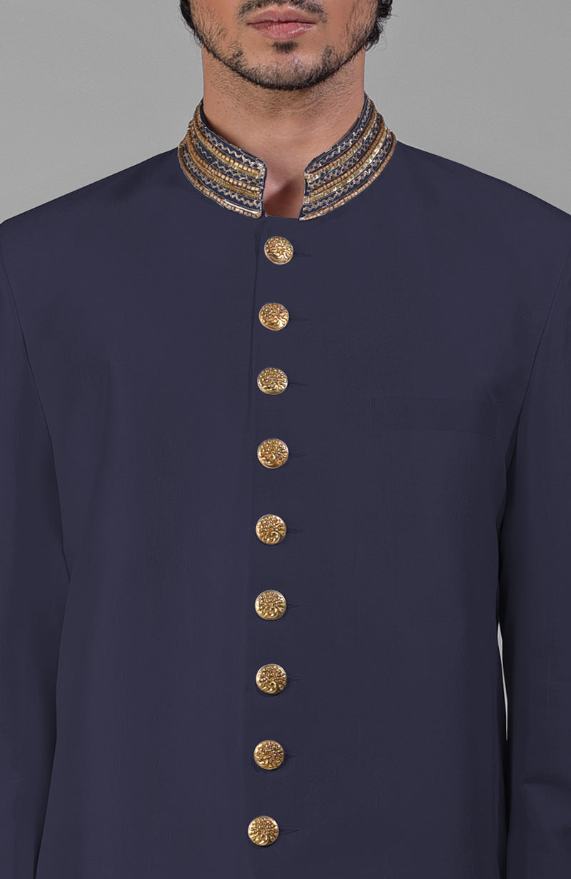 Charcoal grey silk bandhgala jacket with zardozi embroidery and matching tencil cotton pants.