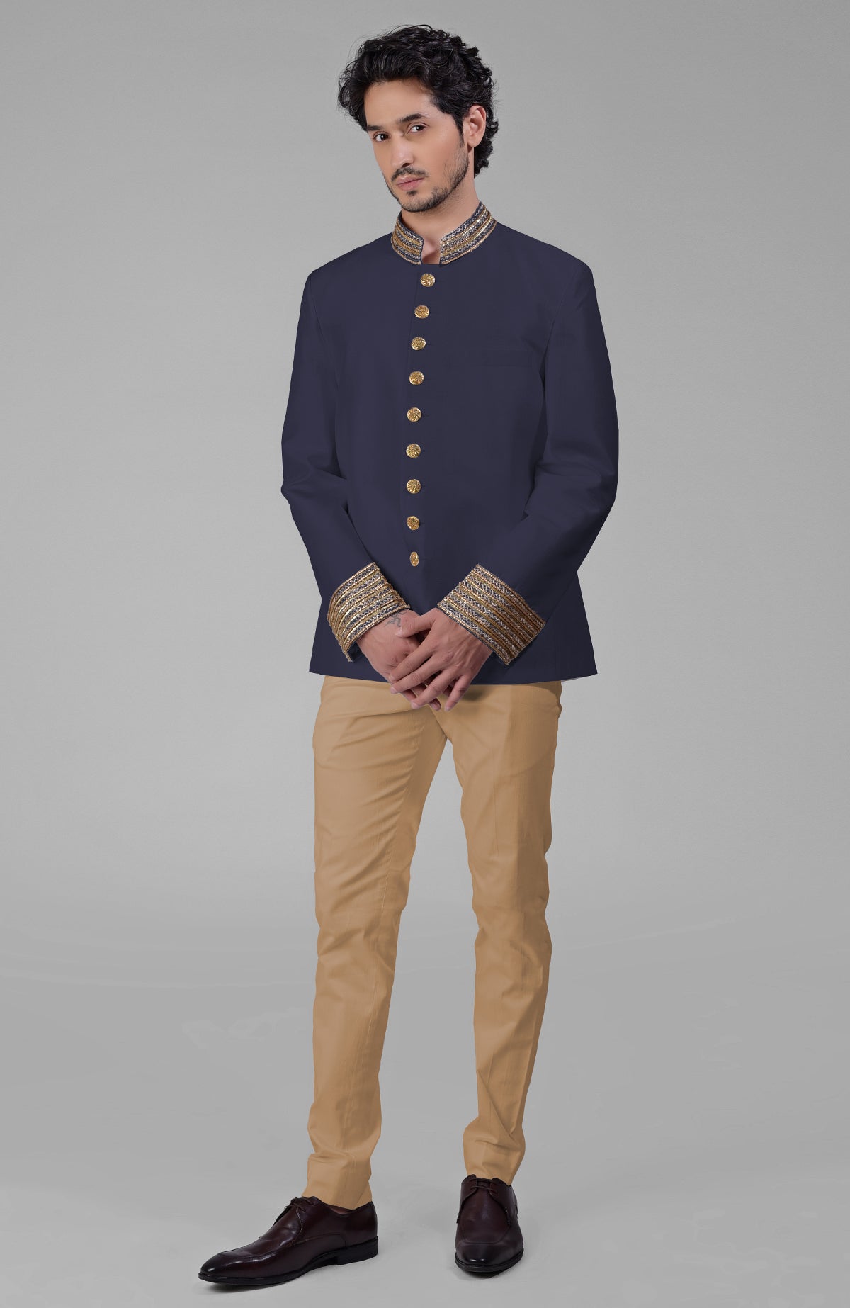 Ivory-gold silk bandhgala jacket with zardozi embroidery and golden buttons paired with white pants