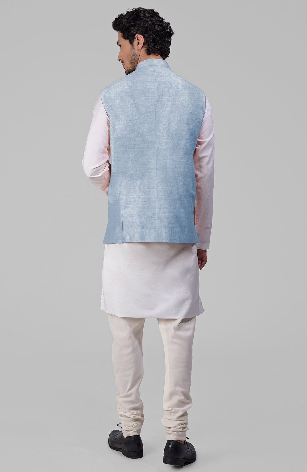 Dusty blue pure raw silk waistcoat bandi jacket with gold peacock emblem buttons and clean lines