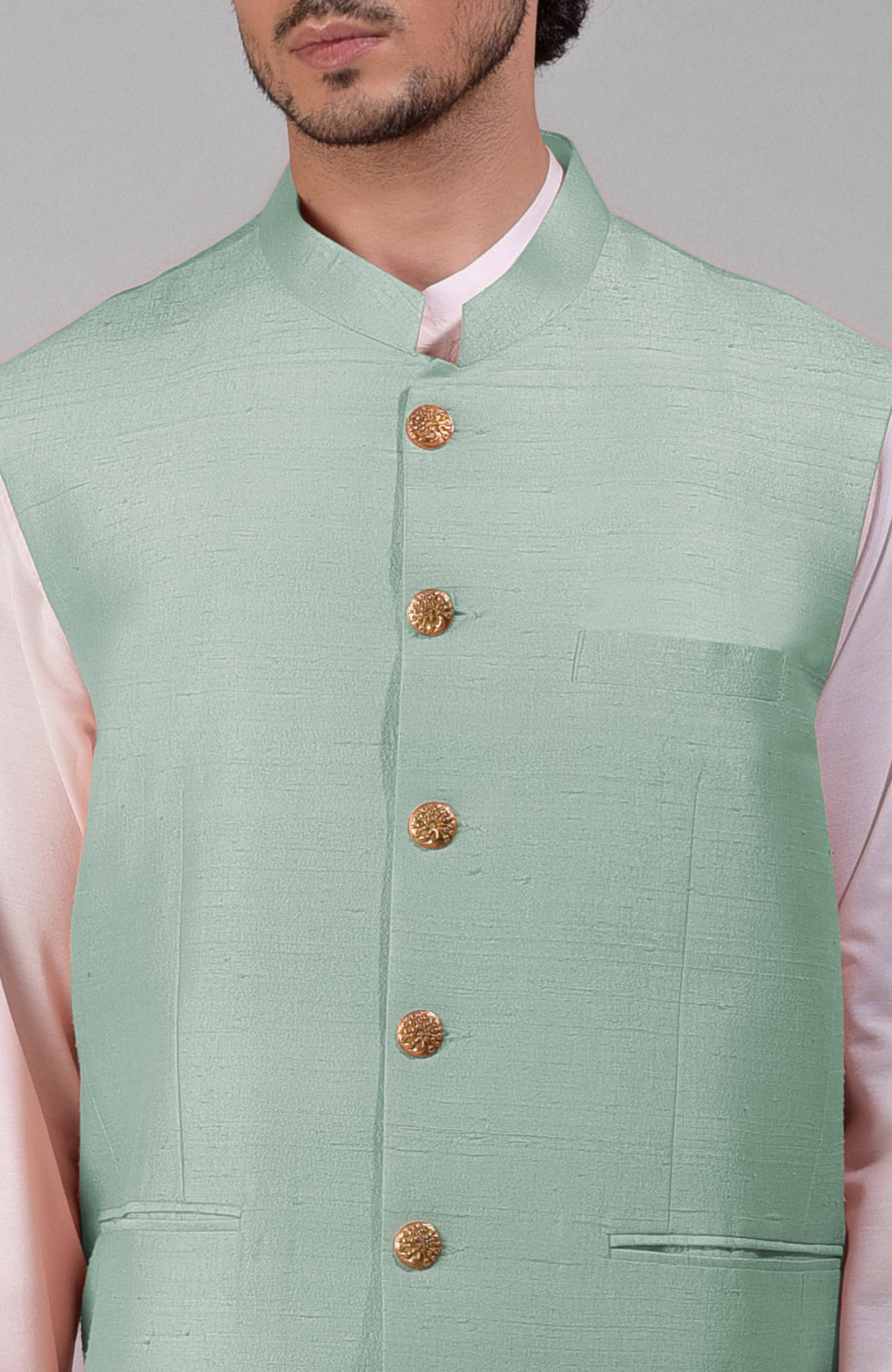 Gossamer green pure raw silk waistcoat bandi jacket with gold peacock button closure.