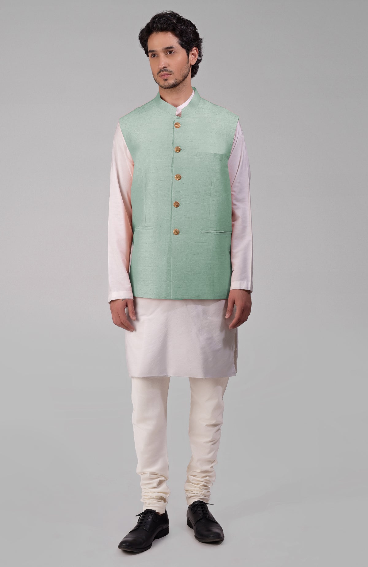 Dusty blue pure raw silk waistcoat bandi jacket with gold peacock emblem buttons.