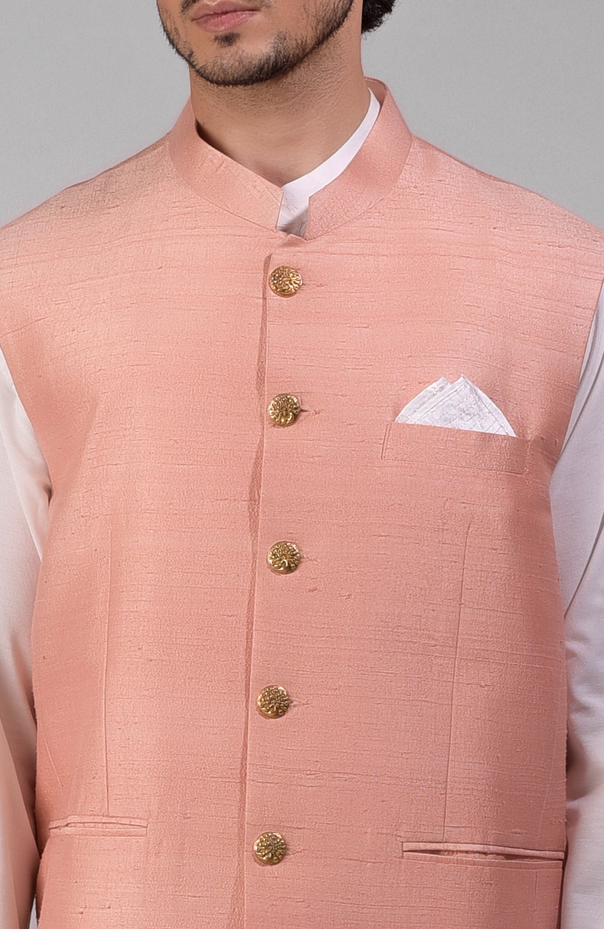 Peach pure raw silk waistcoat bandi jacket with golden buttons and a pocket square.