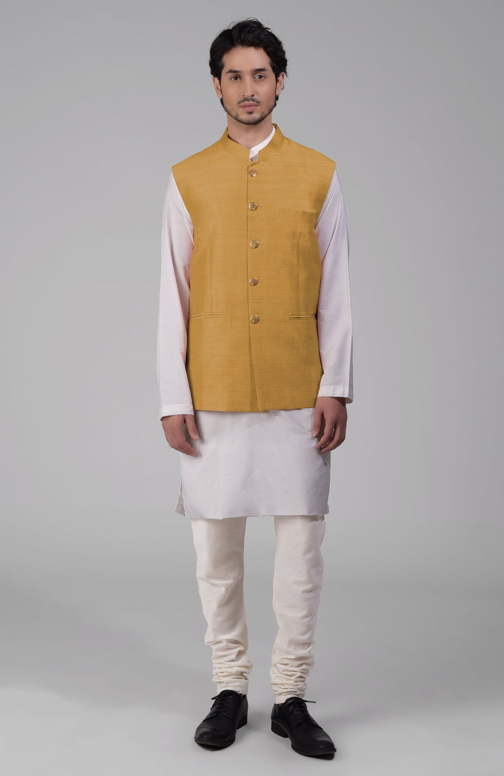 Gold pure raw silk waistcoat bandi jacket with gold peacock emblem buttons and clean lines