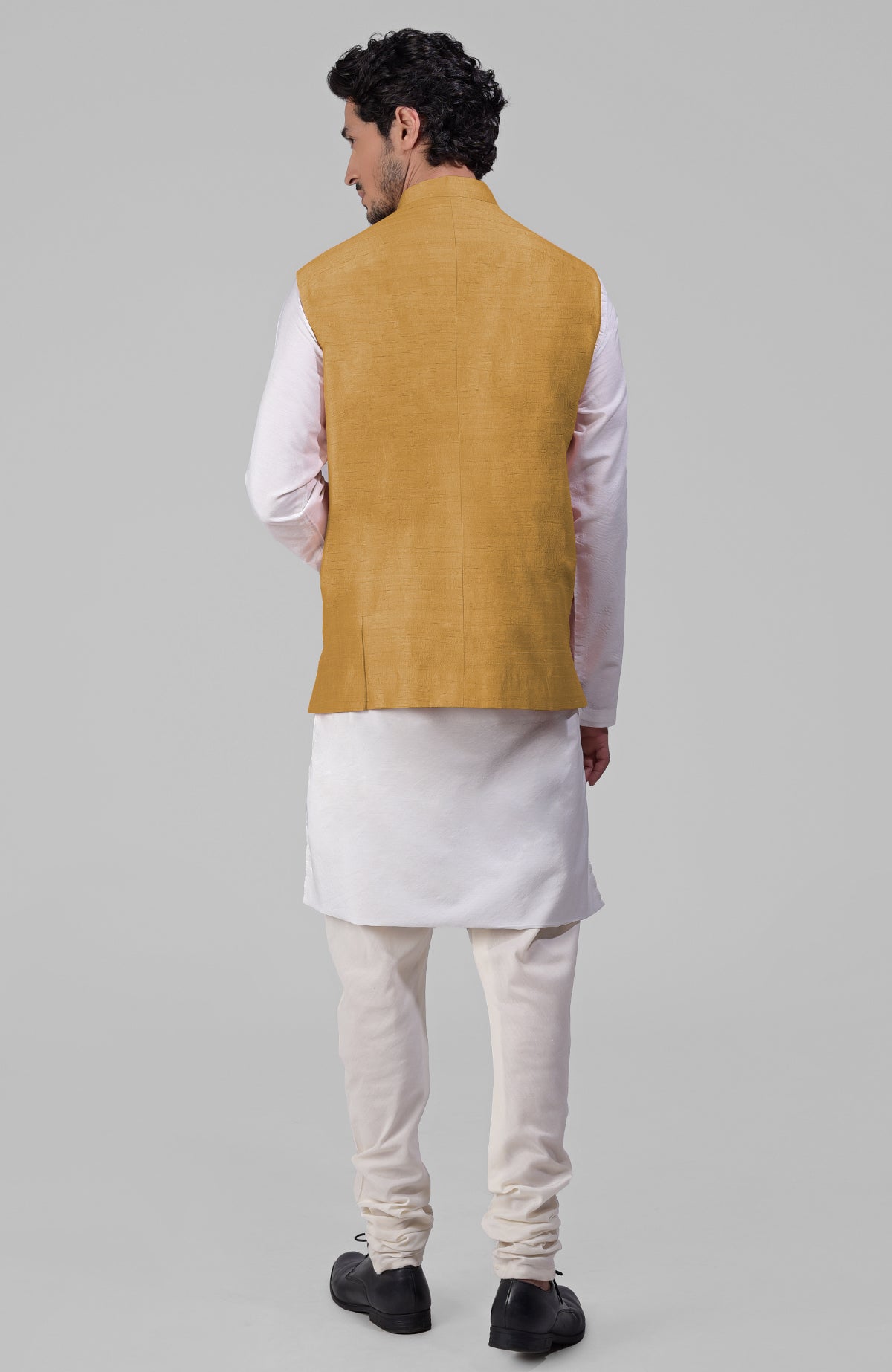 Gold pure raw silk waistcoat bandi jacket with gold peacock emblem buttons and clean lines