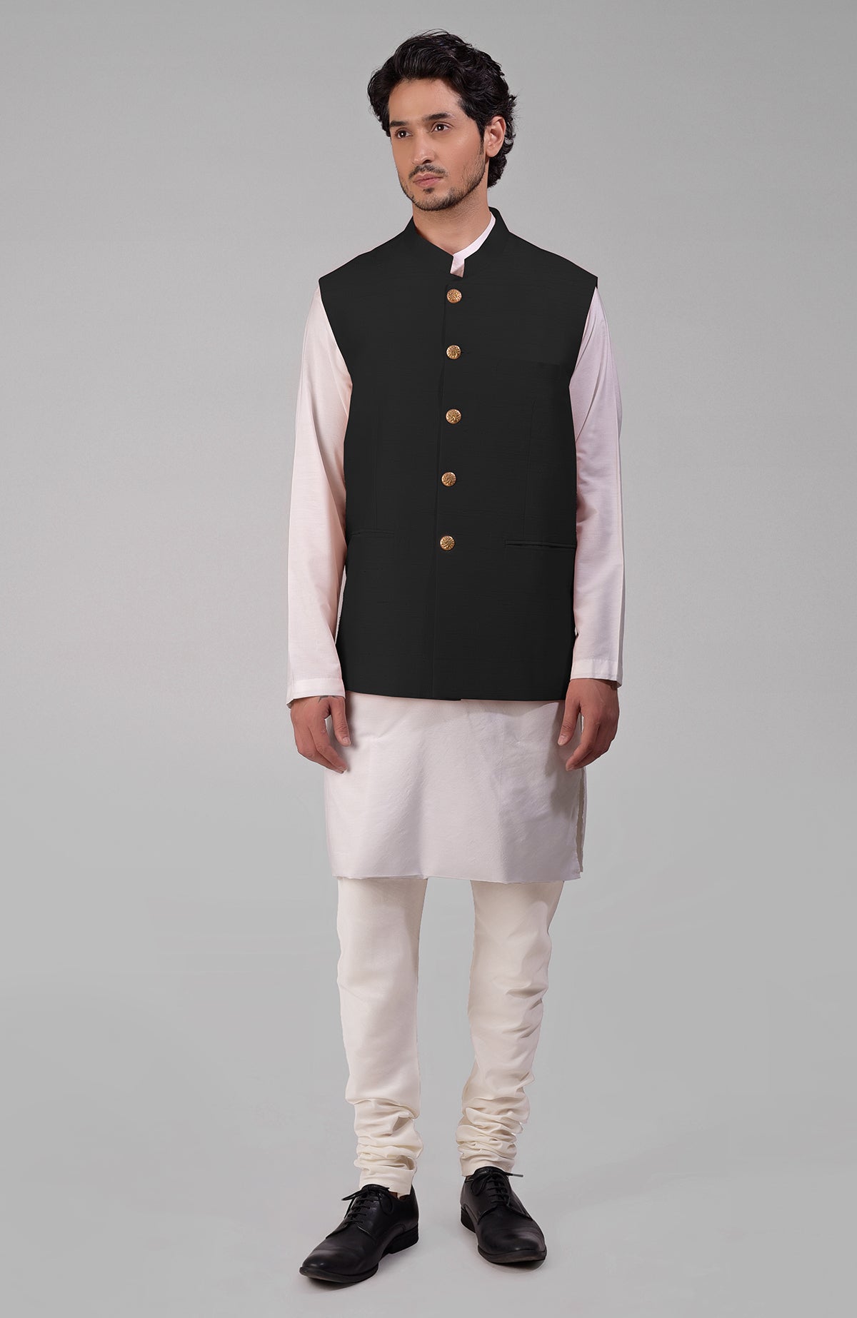 Black pure raw silk waistcoat bandi jacket with gold peacock emblem buttons and clean lines