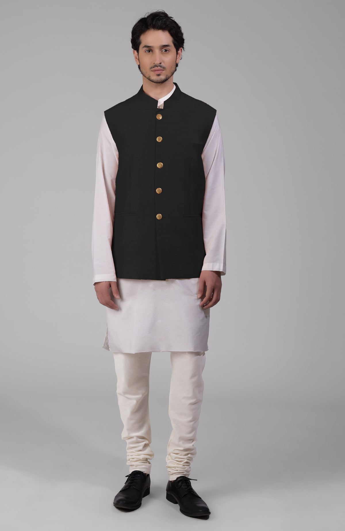 Black pure raw silk waistcoat bandi jacket with gold peacock emblem buttons and clean lines