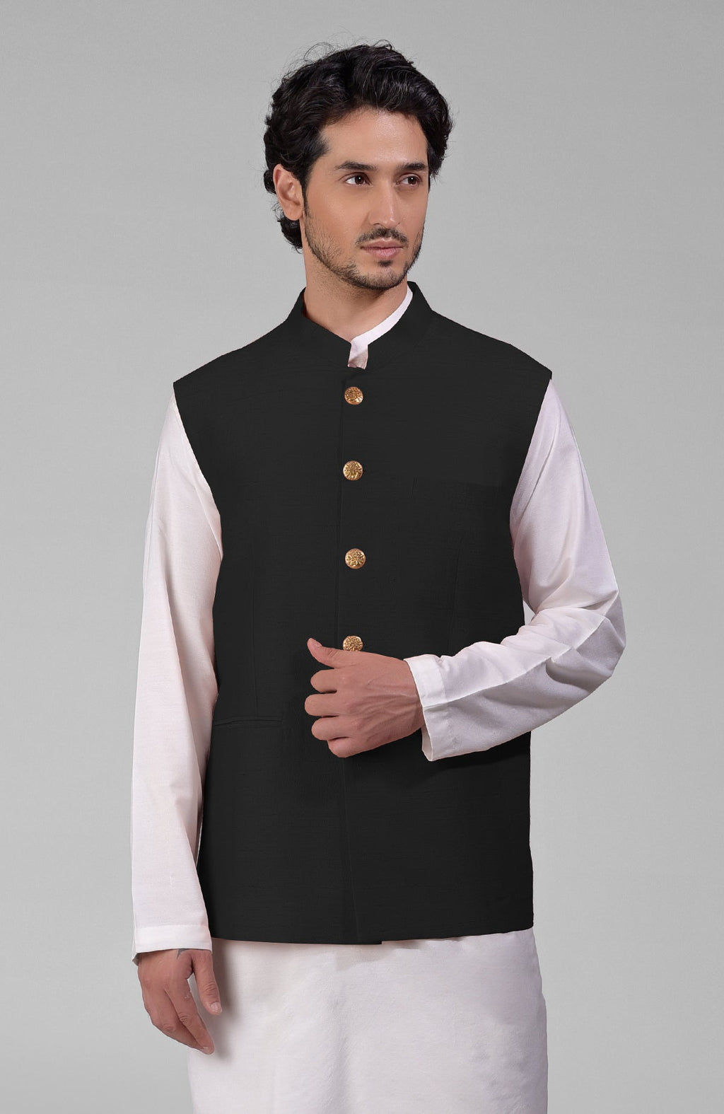 Black pure raw silk waistcoat with gold peacock emblem buttons and a sleek, minimalist design