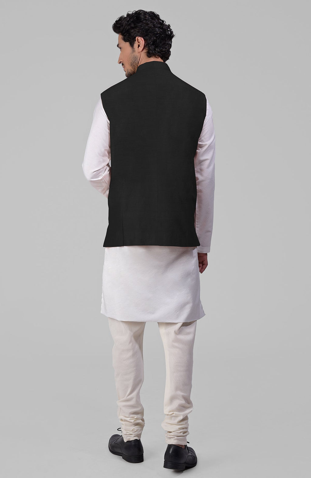 Black pure raw silk waistcoat bandi jacket with gold peacock emblem buttons and clean lines