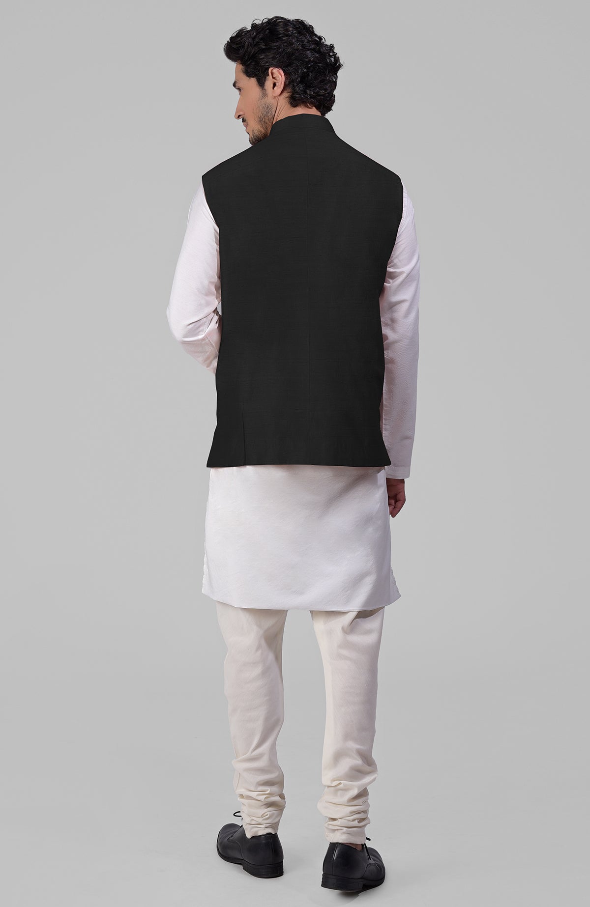 Black pure raw silk waistcoat bandi jacket with gold peacock emblem buttons and clean lines