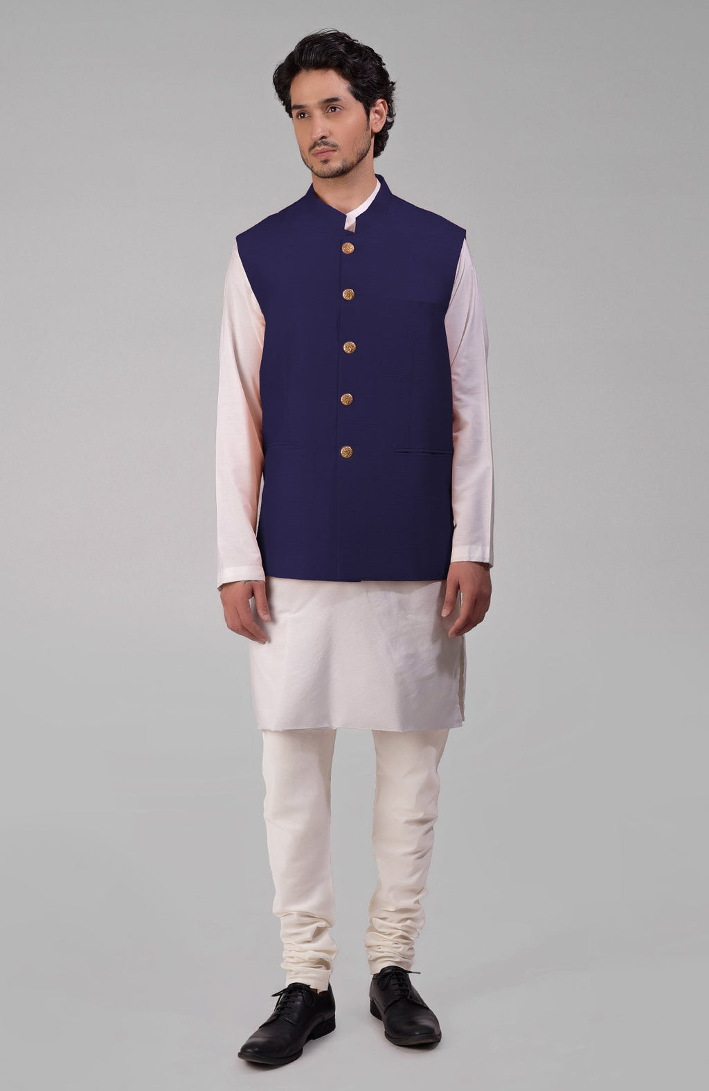 Ink blue pure raw silk waistcoat bandi jacket with gold peacock emblem buttons and clean lines