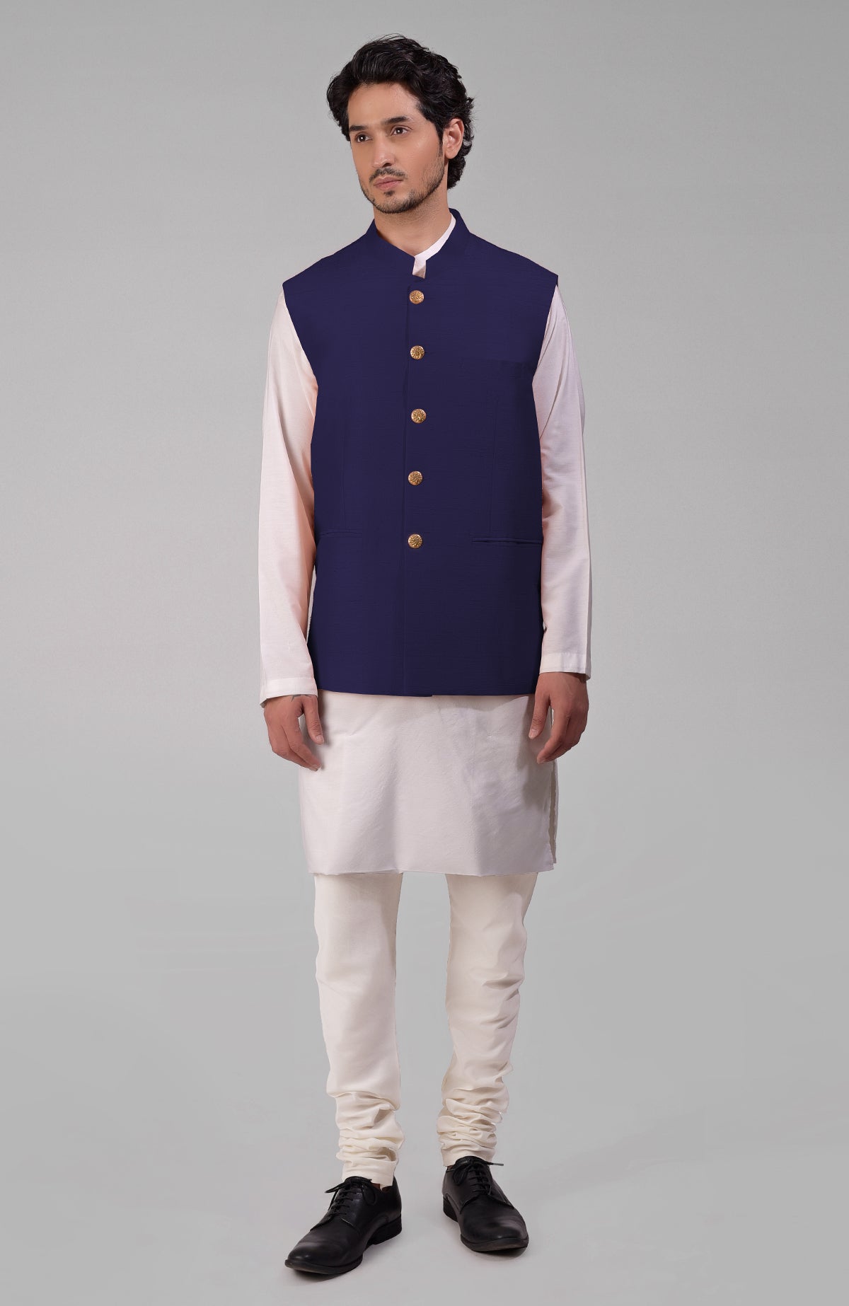 Ink blue pure raw silk waistcoat bandi jacket with gold peacock emblem buttons and clean lines