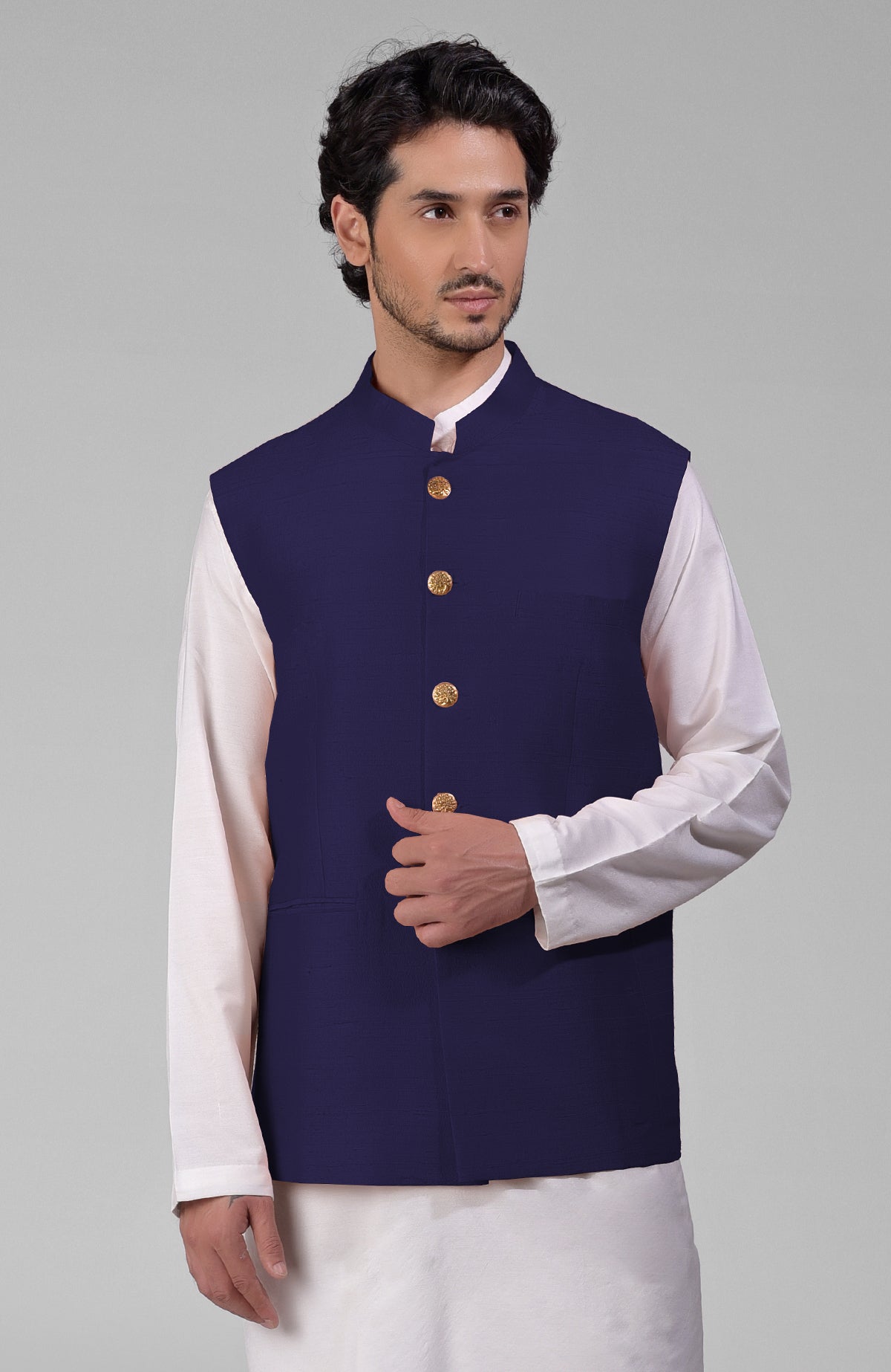 Ink blue pure raw silk waistcoat bandi jacket with gold peacock emblem buttons.