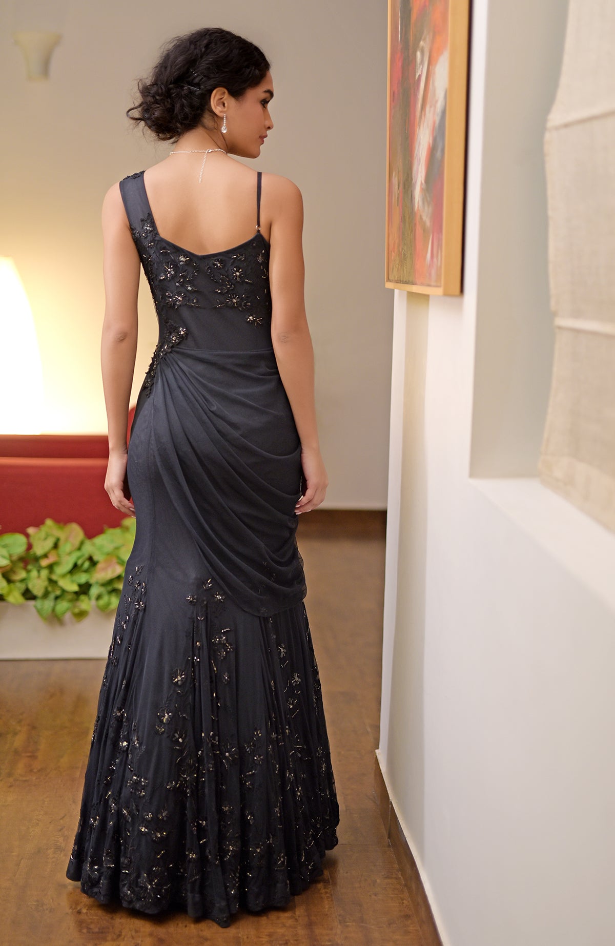 Black hand bead embroidered gown with a mermaid silhouette.